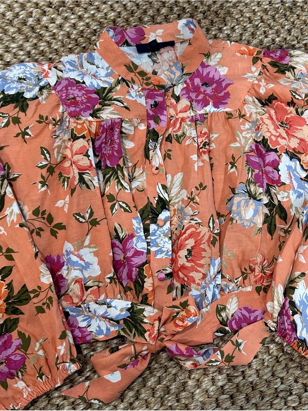 Floral print cropped blouse with strand collar and balloon sleeves and tie front